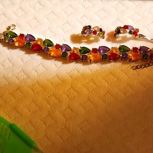 3 piece multi jeweled bracelet and earrings set for pierced earrings.